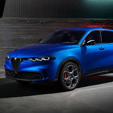 Blue SUV with distinctive wheels and sleek design, parked indoors.