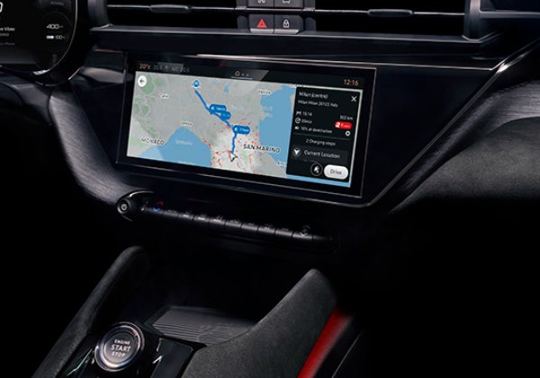 Car dashboard showing navigation system with a map and route details on the screen.