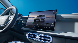 Car interior showing a touchscreen display with a vehicle interface.