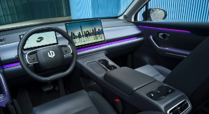 Modern car interior with digital dashboard and purple ambient lighting.