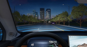 Car dashboard view with autonomous driving display at night.