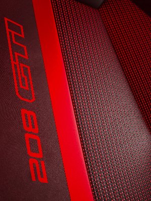 Close-up of a car seat with red stitching and the text 208 GT.