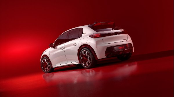 White Peugeot 208 GTI car viewed from the rear on a plain red surface.