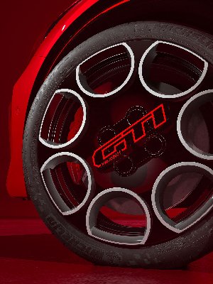 Close-up of a car wheel featuring the GTI logo and Michelin tyre.