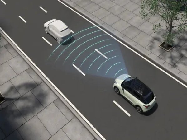 Car using detection technology on a road, visualised with blue radar lines.