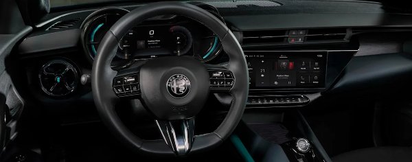 Alfa Romeo car interior with steering wheel and digital display.