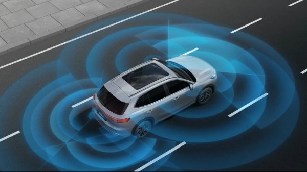Silver SUV displaying blue radar waves on the road.