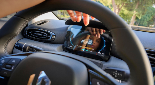 Driver adjusting digital dashboard in a car's steering wheel view.